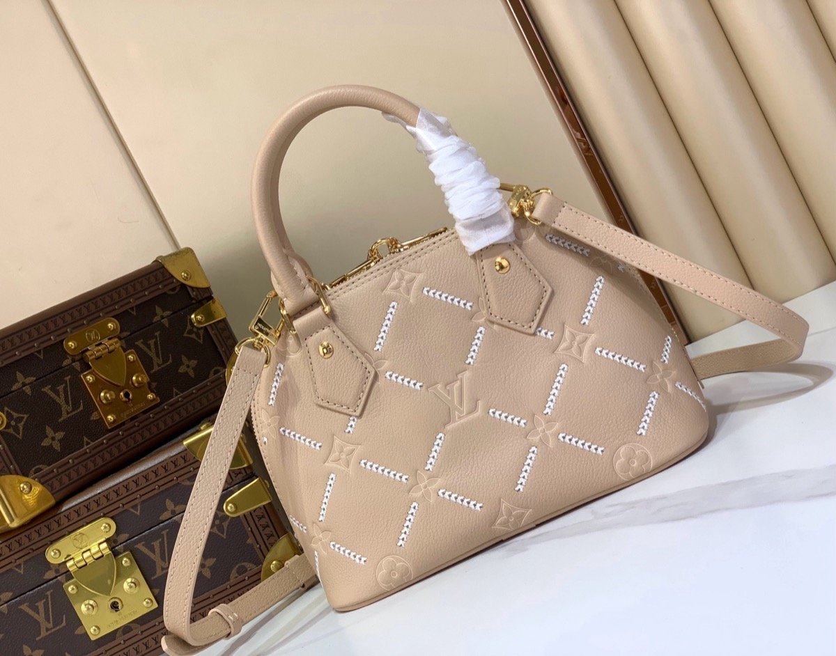 Taupe Embroidered Top Handle Bag side view with embroidered texture and smooth trim
