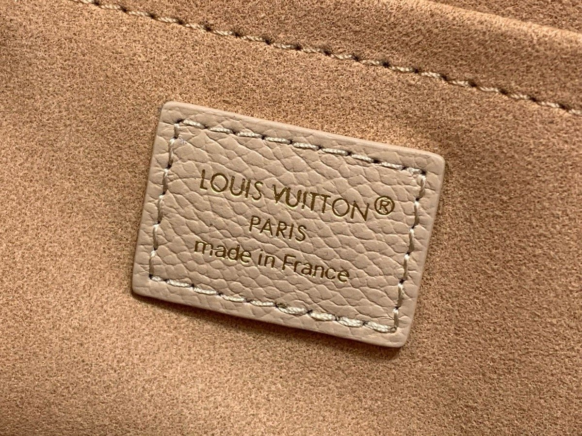 Taupe Embroidered Top Handle Bag strap detail view with embroidered texture and smooth trim