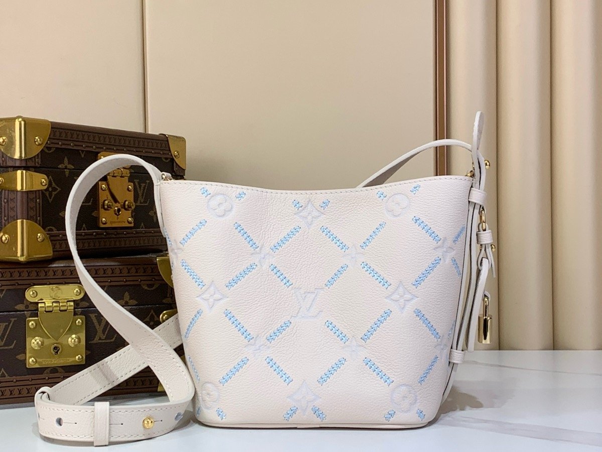 White Embroidered Bucket Bag back view with embroidered texture and light trim