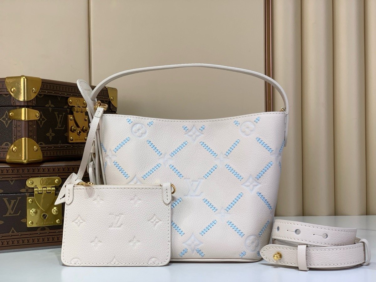 White Embroidered Bucket Bag front view with embroidered texture and light trim