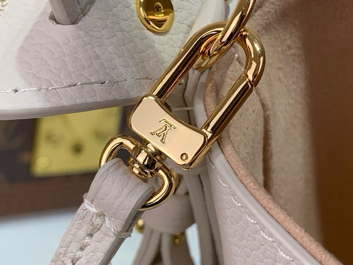 White Embroidered Bucket Bag interior view with embroidered texture and light trim