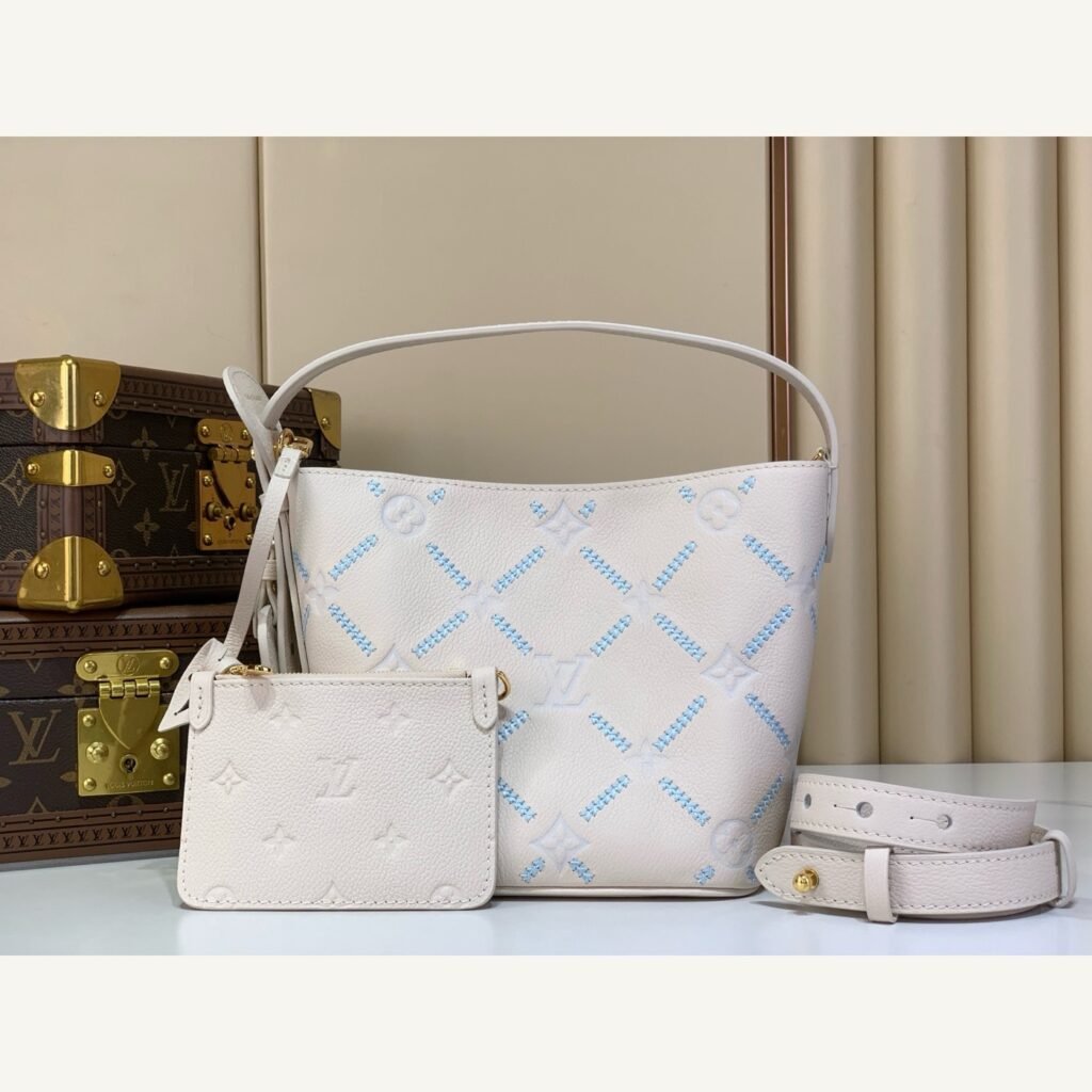 White Embroidered Bucket Bag full front view on neutral thumbnail background