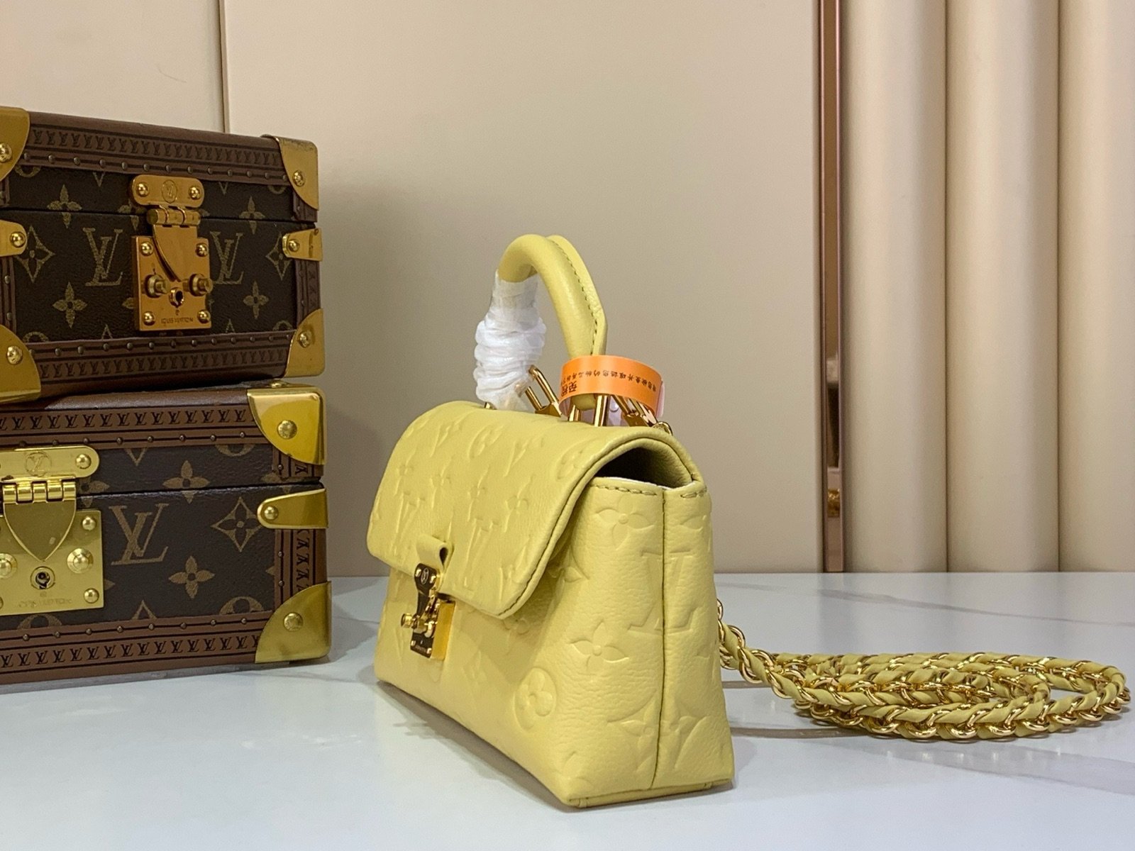 Yellow And Purple Nano Top Handle Bag angle view with smooth color finish and compact handle