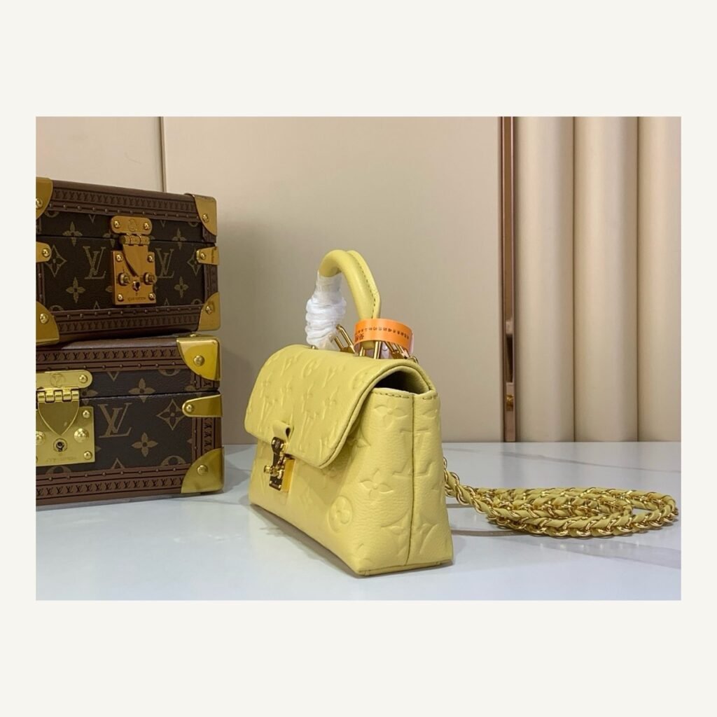Yellow And Purple Nano Top Handle Bag angle view with smooth color finish and compact handle on neutral thumbnail background
