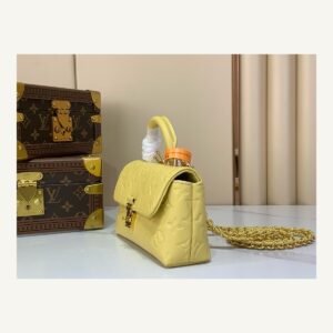 Yellow And Purple Nano Top Handle Bag angle view with smooth color finish and compact handle on neutral thumbnail background
