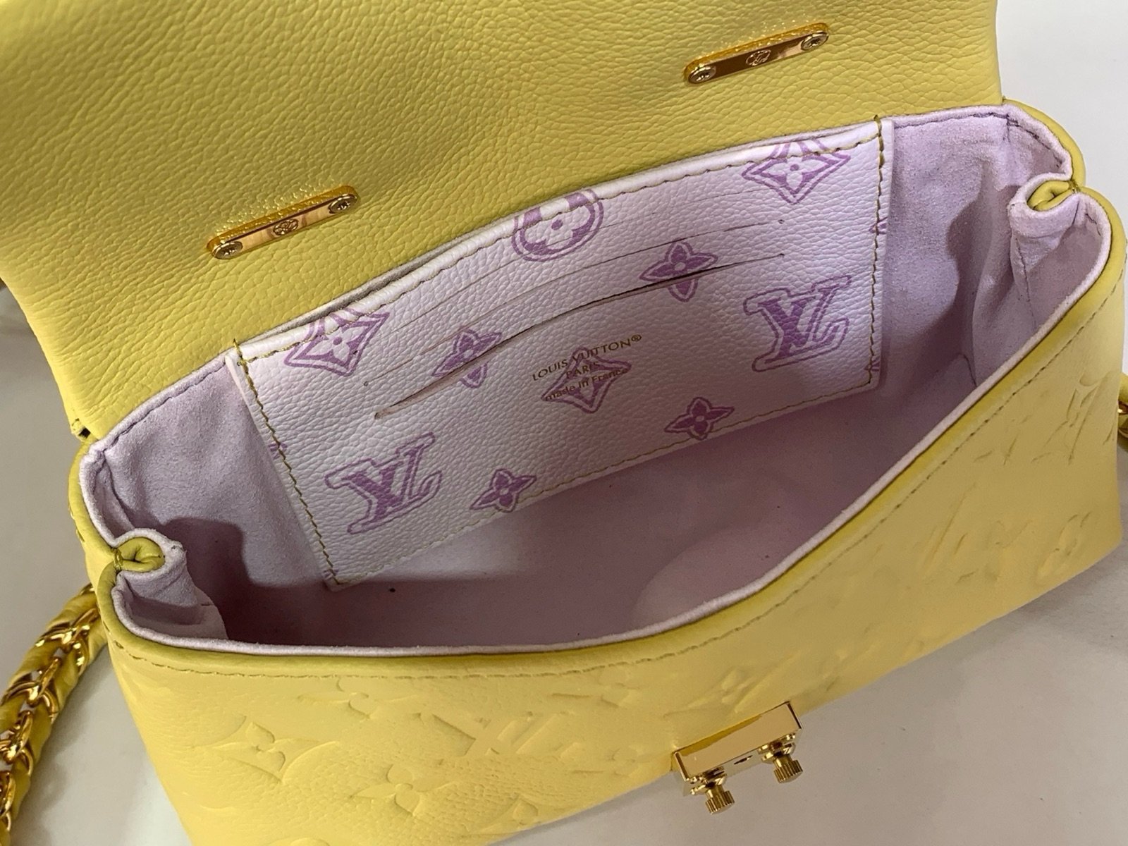 Yellow And Purple Nano Top Handle Bag interior view with smooth color finish and compact handle