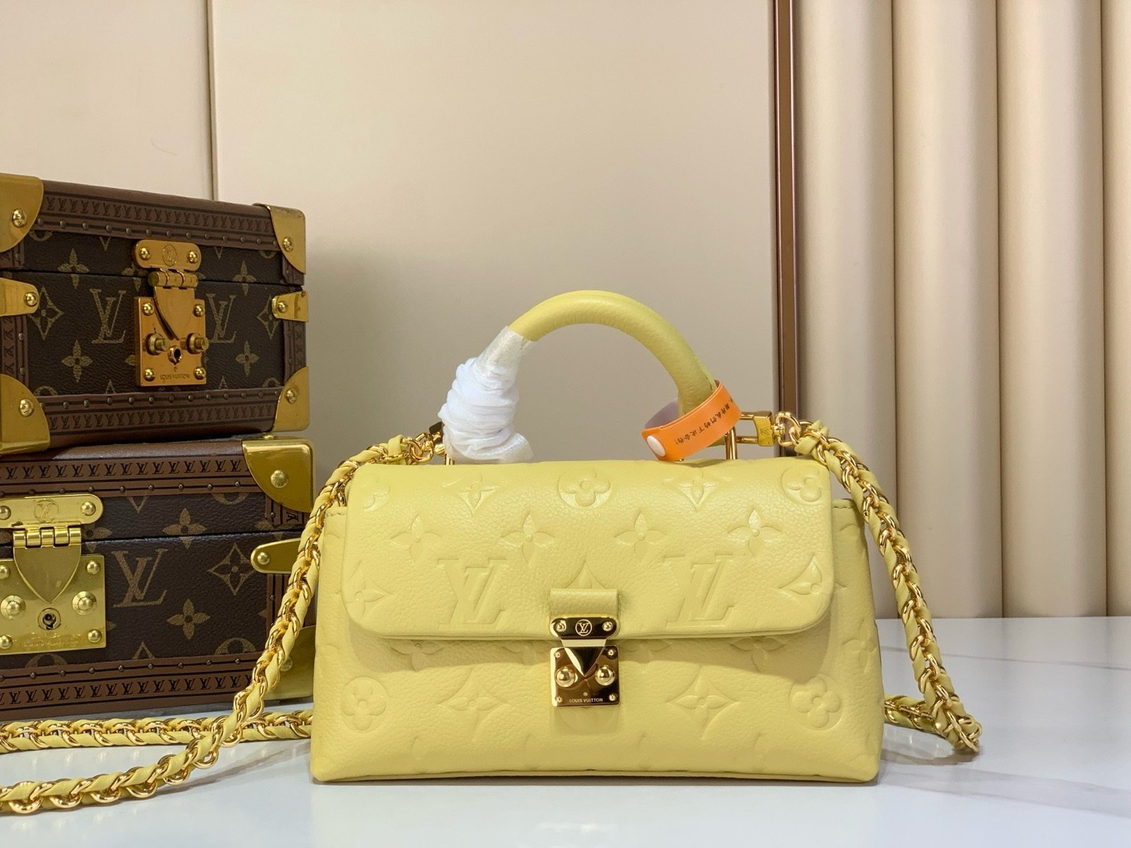 Yellow And Purple Nano Top Handle Bag strap detail view with smooth color finish and compact handle
